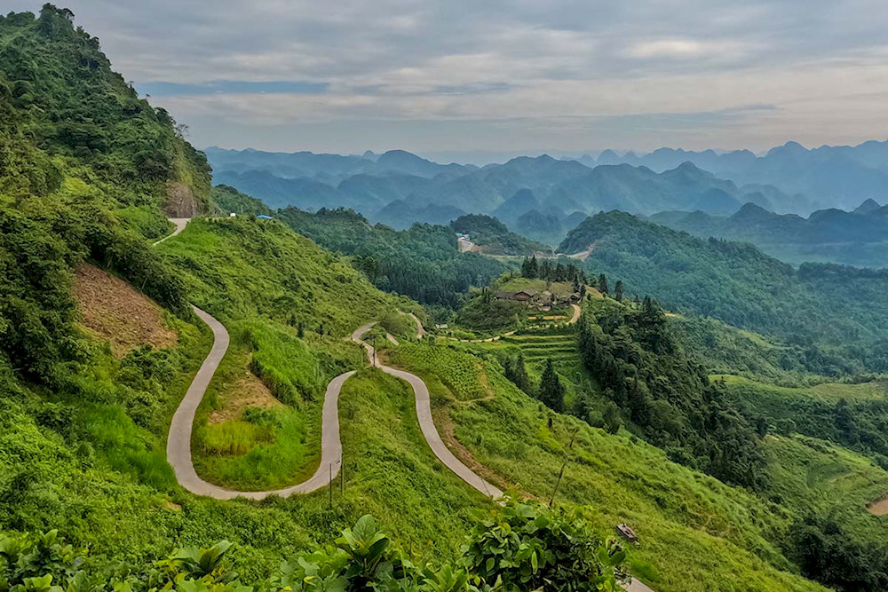 Panoramic views of limestone peaks, valleys, and drifting clouds from elevated vantage points